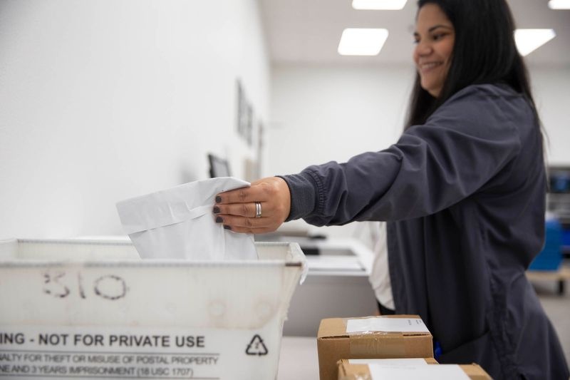 Prescription Mart team member preparing mailed prescriptions