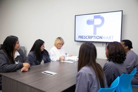 Prescription Mart team collaborating at the pharmacy